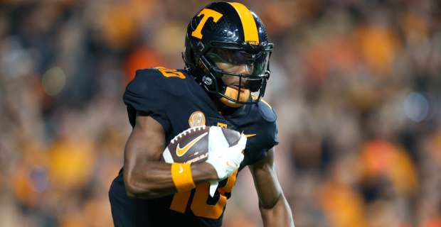 Tennessee Volunteers wide receiver Squirrel White catches a pass during a college football game in the SEC.